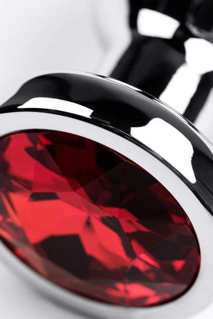 Серебристая удлиненная коническая анальная пробка с красным кристаллом - 10 см. 